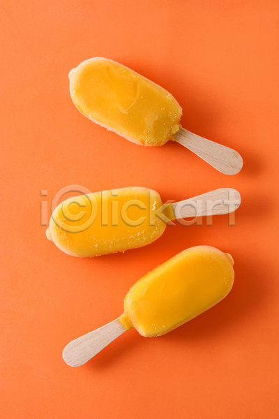 사람없음 JPG 포토 해외이미지 막대아이스크림 세개 실내 아이스크림 오렌지맛 주황색배경 하드