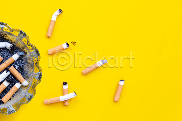 사람없음 JPG 포토 해외이미지 노란배경 담배 담배꽁초 담뱃재 실내 재떨이 카피스페이스 흡연
